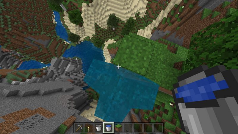 Step 2 for using a water bucket to create a waterfall for safe travel in Minecraft
