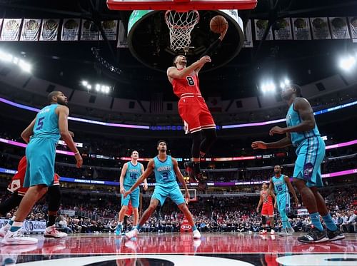 Zach LaVine #8 of the Chicago Bulls drives the lane to put up a shot against the Charlotte Hornets 