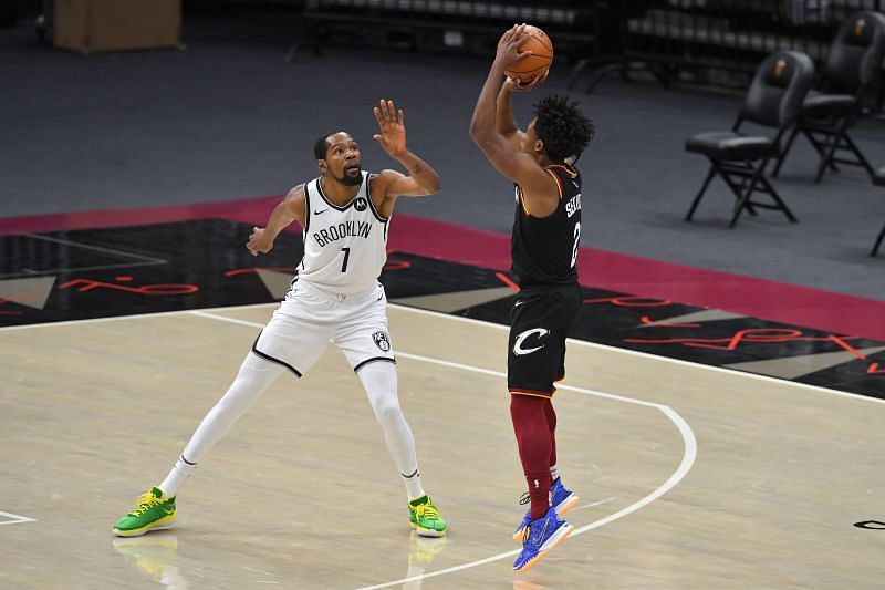 Collin Sexton #2 of the Cleveland Cavaliers shoots over Kevin Durant #7 of the Brooklyn Nets.