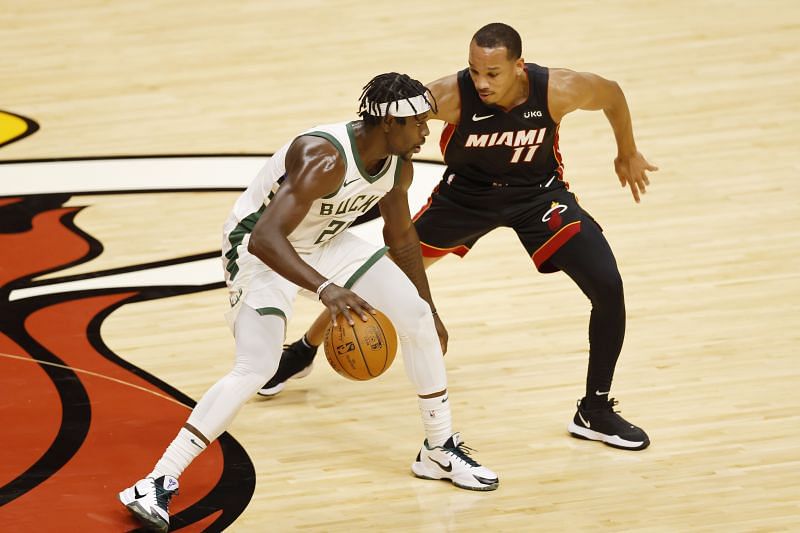 Jrue Holiday #21 of the Milwaukee Bucks is defended by Avery Bradley