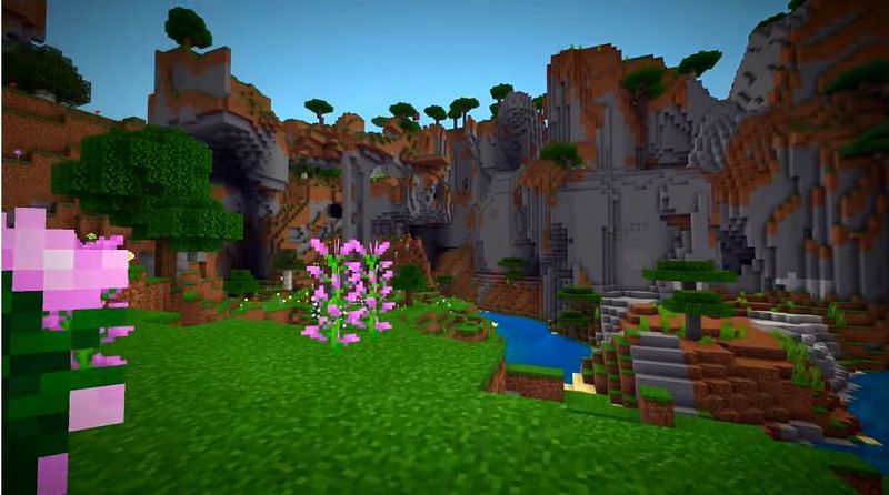 Shattered savanna biome that is filled with flowers and has a natural river. (Image via Minecraft &amp; Chill/YouTube