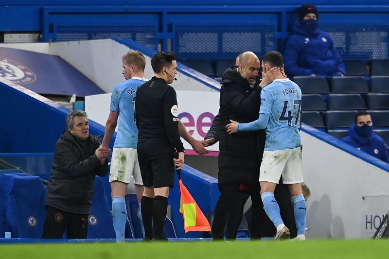 Pep Guardiola embraces Phil Foden following his performance against Chelsea on Sunday
