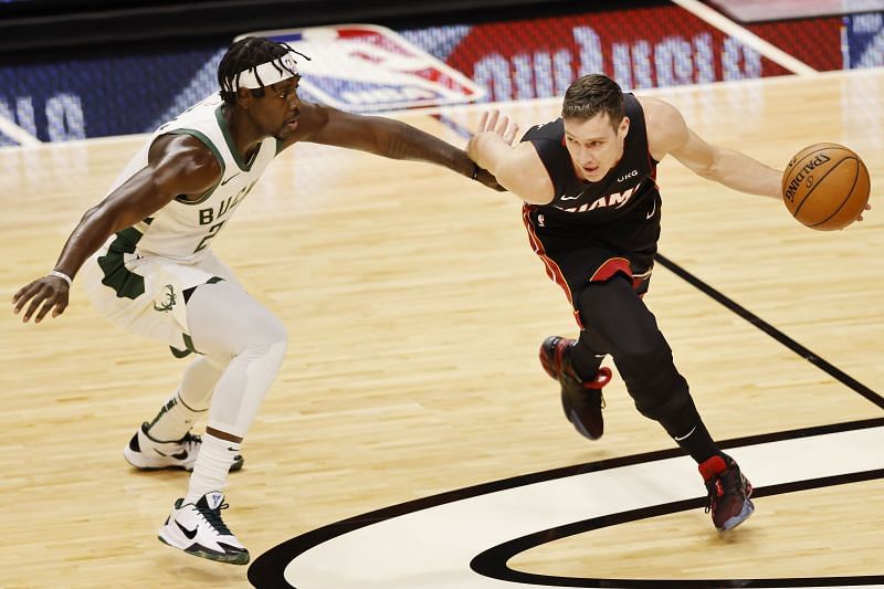 Goran Dragic #7 of the Miami Heat drives to the basket past Jrue Holiday #21 of the Milwaukee Bucks during the second quarter at American Airlines Arena on December 29, 2020 (Photo by Michael Reaves/Getty Images)