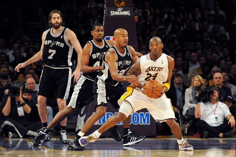 Kobe Bryant #24 of the Los Angeles Lakers moves the ball against Bruce Bowen #12 of the San Antonio Spurs.