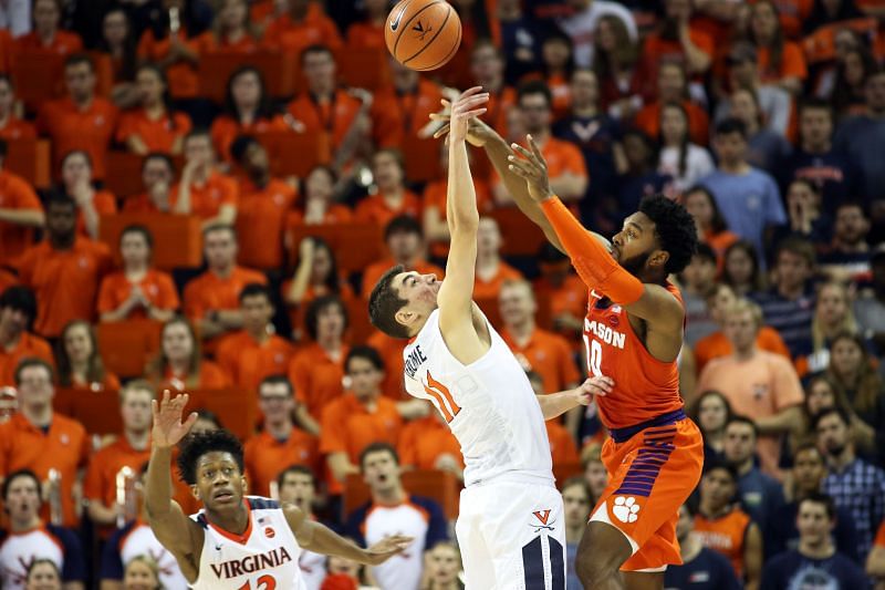 Virginia Cavaliers&#039; player tips a pass by the Clemson Tigers&#039; player