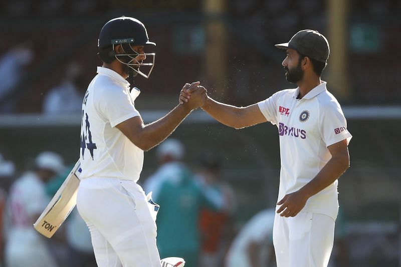 Hanuma Vihari (L) congratulated by stand-in skipper Ajinkya Rahane after India forced a draw