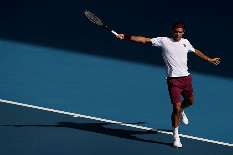 Roger Federer hitting a backhand