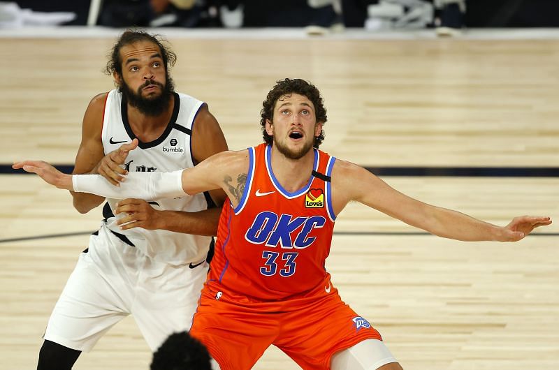 Mike Muscala #33 of the Oklahoma City Thunder and Joakim Noah #55 of the LA Clippers battle for position.