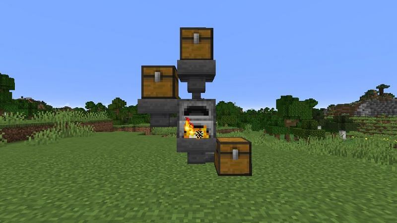 Three chests and three hoppers, connected to a single furnace in Minecraft. (Image via Minecraft)