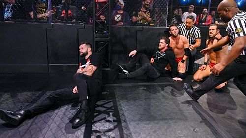 Finn Balor and Undisputed Era after the brawl in the main event.