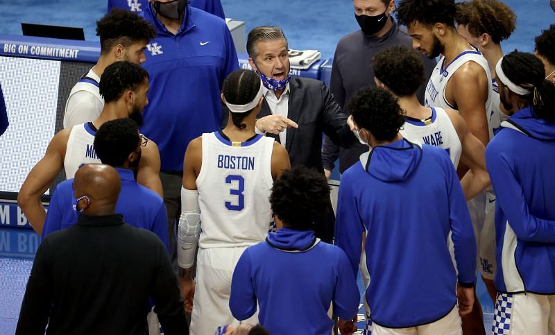 John Calipari, the head coach of the Kentucky Wildcats, gives instructions to his team.