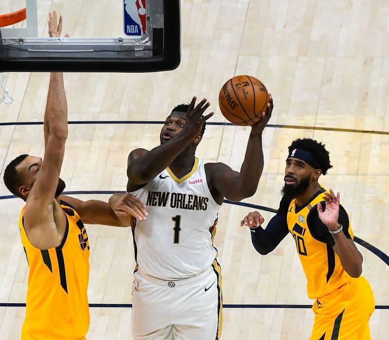 Zion Williamson of the New Orleans Pelicans shoots over Rudy Gobert.