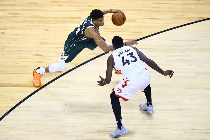 Giannis Antetokounmpo of the Milwaukee Bucks dribbles against Pascal Siakam of the Toronto Raptors during the second half in game three of the 2019 NBA Eastern Conference Finals&nbsp;