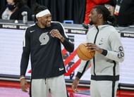 Robert Covington #23 of the Portland Trail Blazers and Naz Reid #11 of the Minnesota Timberwolves.