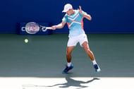 Alex de Minaur hits a forehand