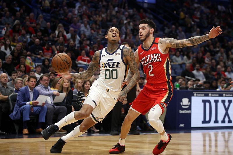 Jordan Clarkson of the Utah Jazz drives the ball around Lonzo Ball.