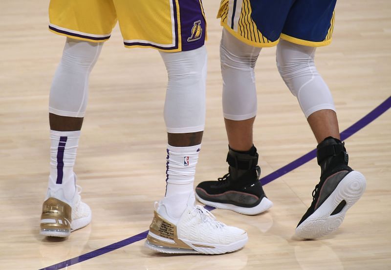 LeBron James and Steph Curry sport their own shoes