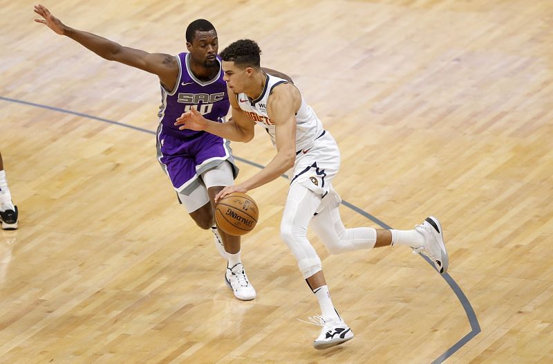 Michael Porter Jr. #1 of the Denver Nuggets is guarded by Harrison Barnes #40 of the Sacramento Kings.