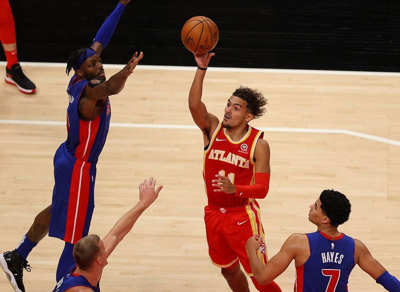 Trae Young #11 of the Atlanta Hawks attempts a shot against Jerami Grant #9, Killian Hayes #7 and Mason Plumlee #24 of the Detroit Pistons during the second half at State Farm Arena on December 28, 2020 (Photo by Kevin C. Cox/Getty Images)