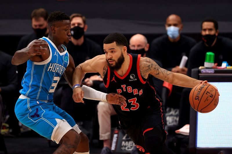 Fred VanVleet #23 of the Toronto Raptors drives on Terry Rozier #3 of the Charlotte Hornets.
