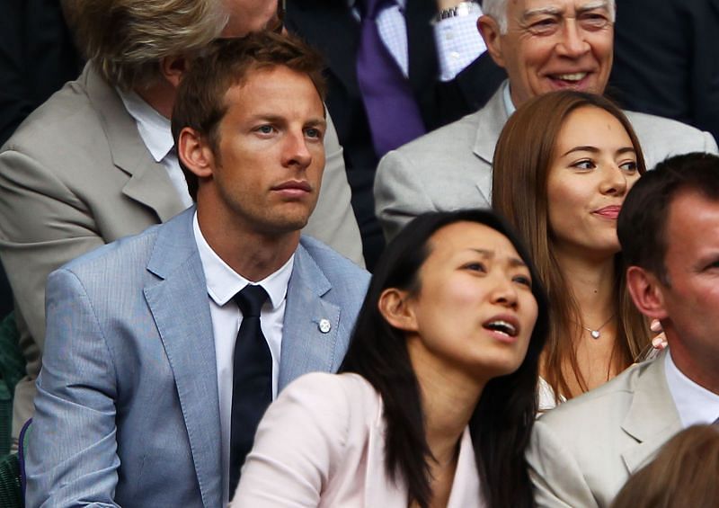 Jenson Button (front left) watches the final between Rafael Nadal and Novak Djokovic at Wimbledon 2011