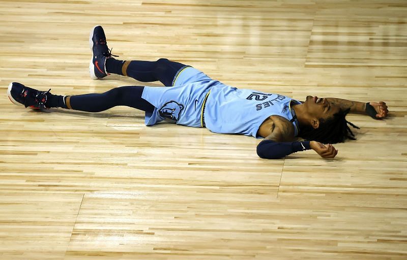 Ja Morant of the Memphis Grizzlies lays on the ground.