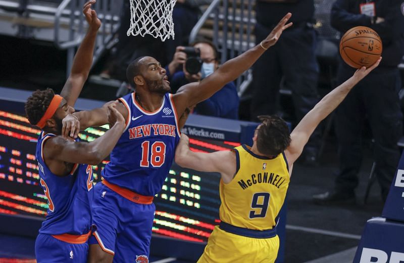 Alec Burks of the New York Knicks defends against T.J. McConnell of the Indiana Pacers 