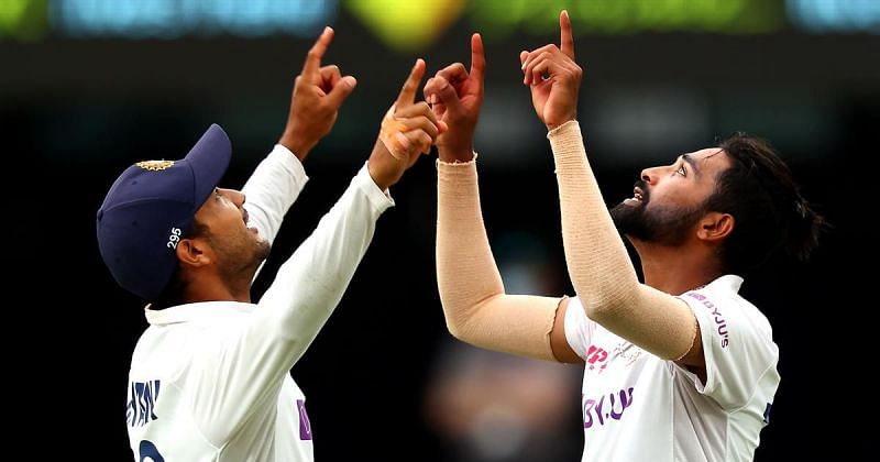 Mohammed Siraj celebrates with Mayank Agarwal after picking up his maiden five-wicket haul.