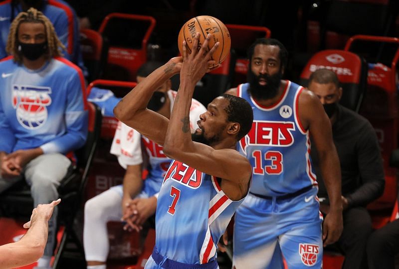 Kevin Durant shoots as teammate James Harden looks on during a game against the Orlando Magic.&nbsp;