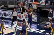 Myles Turner #33 of the Indiana Pacers blocks the shot of Jayson Tatum #0 of the Boston Celtics.