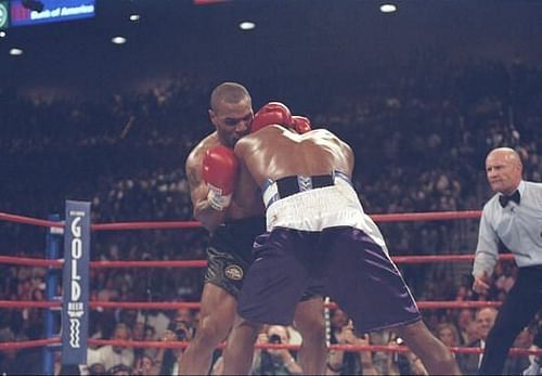 Mike Tyson biting Evander Holyfield's ear during their rematch in 1997.