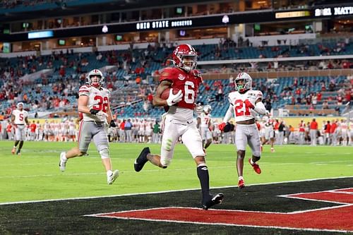 Smith scoring one of his three first-half touchdowns in the CFP Championship