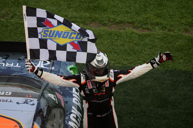 Noah Gragson, driver of the #9 Bass Pro Shops/BRCC Chevrolet, celebrates with the checkered flag after winning the NASCAR Xfinity Series NASCAR Racing Experience 300 at Daytona International Speedway.