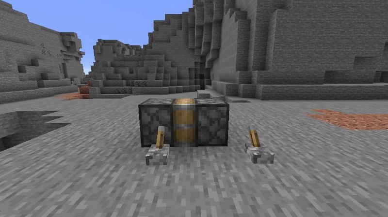 A contraption in Minecraft made out of a piston, sticky piston, and two levers. (Image via Minecraft)