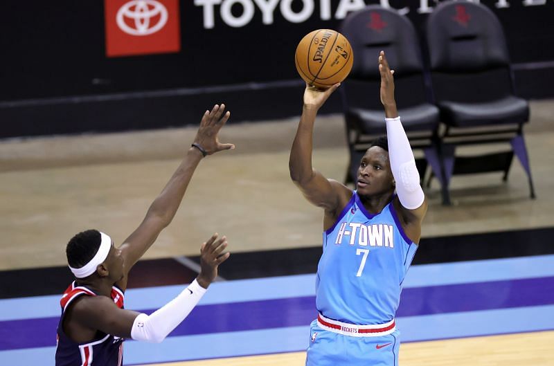 Victor Oladipo #7 of the Houston Rockets puts up a jump shot over Isaac Bonga #17 of the Washington Wizards during the third quarter at Toyota Center on January 26, 2021 in Houston, Texas. (Photo by Carmen Mandato/Getty Images)