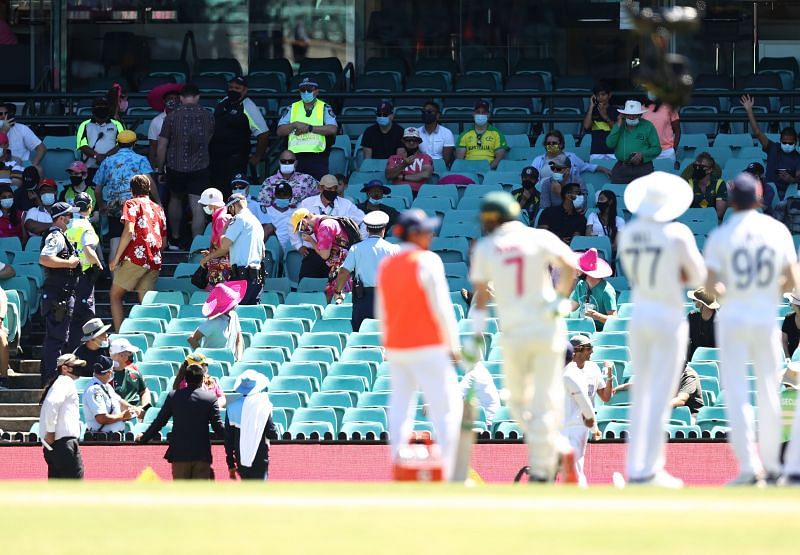 Members from the crowd being evicted by security during the SCG Test