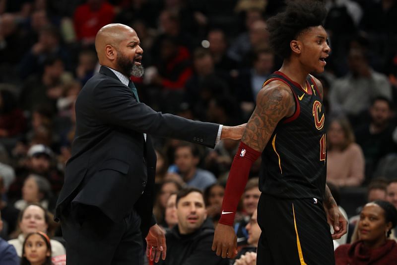 Head coach J.B. Bickerstaff of the Cleveland Cavaliers walks Kevin Porter Jr. of the Cleveland Cavaliers off of the court
