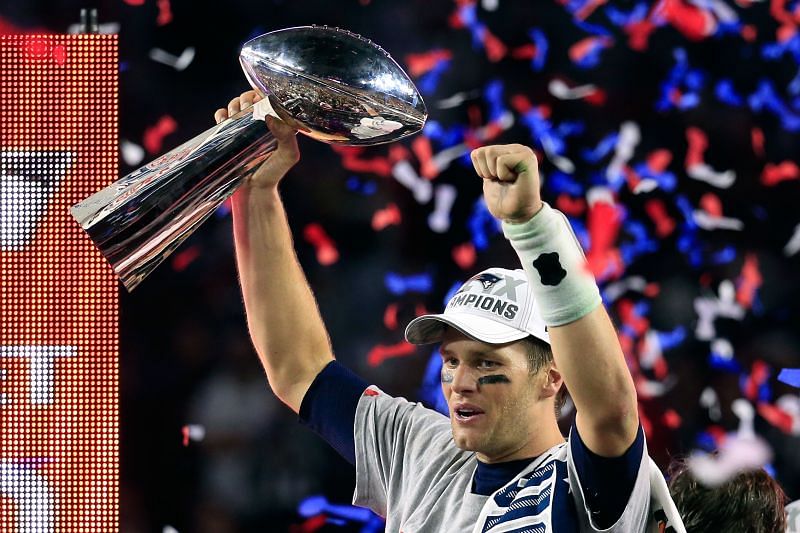 Former New England Patriots quarterback Tom Brady hoisting the Lombardi Trophy