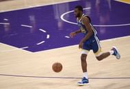Andrew Wiggins #22 of the Golden State Warriors brings the ball up the court