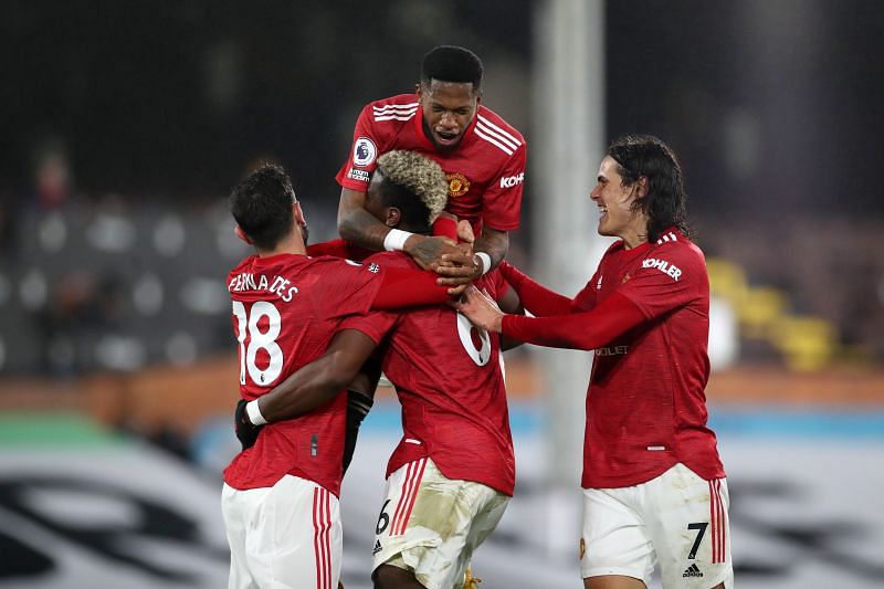 Manchester United returned to the summit of the Premier League table with a 2-1 win over Fulham.