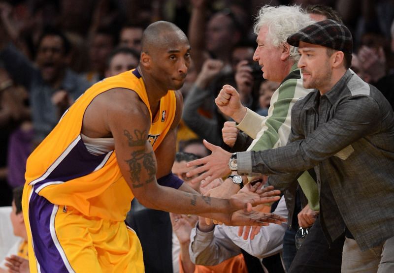 Kobe Bryant #24 of the Los Angeles Lakers reacts with Justin Timberlake after he makes a basket against the Denver Nuggets in Game Seven of the Western Conference Quarterfinals in the 2012 NBA Playoffs (Photo by Harry How/Getty Images)