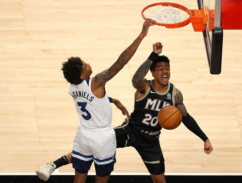 John Collins of the Atlanta Hawks dunks against Jaden McDaniels of the Minnesota Timberwolves&nbsp;