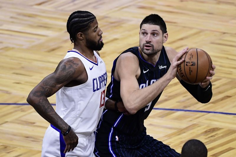 Nikola Vucevic #9 of the Orlando Magic looks to shoot the ball as Paul George #13 of the LA Clippers defends