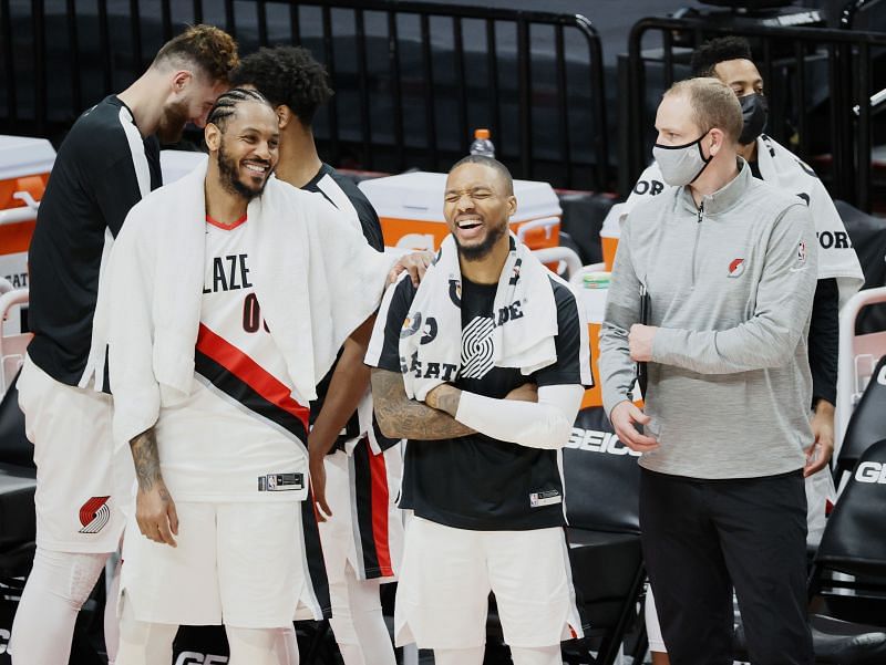 Carmelo Anthony #00 and Damian Lillard #0 of the Portland Trail Blazers react