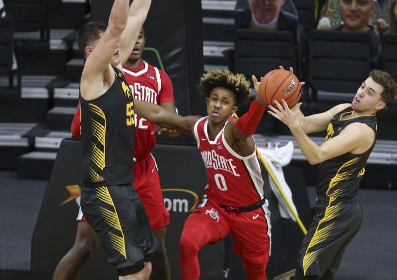 Guard Meechie Johnson #0 of the Ohio State Buckeyes battles for a rebound in the second half with guard Jordan Bohannon #3 and forward Luka Garza #55 of the Iowa Hawkeyes