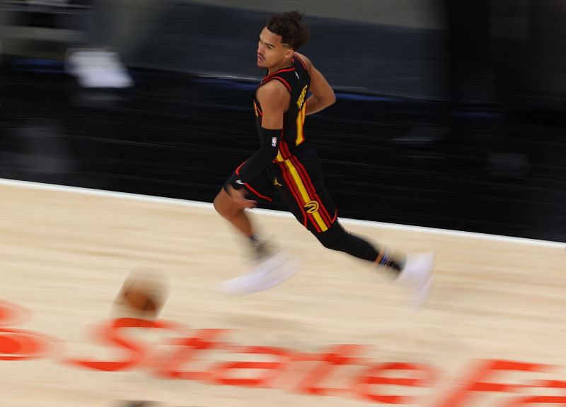 Trae Young #11 of the Atlanta Hawks runs the ball downcourt against the Denver Nuggets