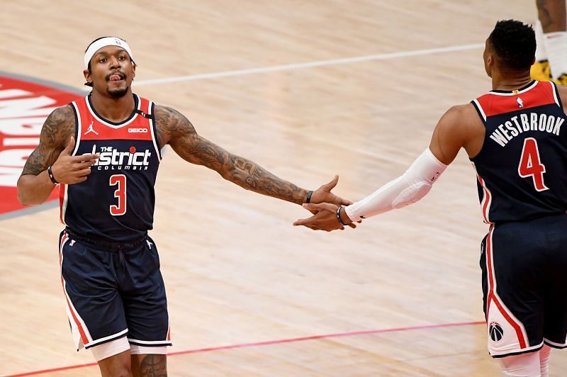 Bradley Beal #3 of the Washington Wizards celebrates with Russell Westbrook #4 after a play against the Houston Rockets during the first half at Capital One Arena on February 15, 2021, in Washington, DC. (Photo by Will Newton/Getty Images)