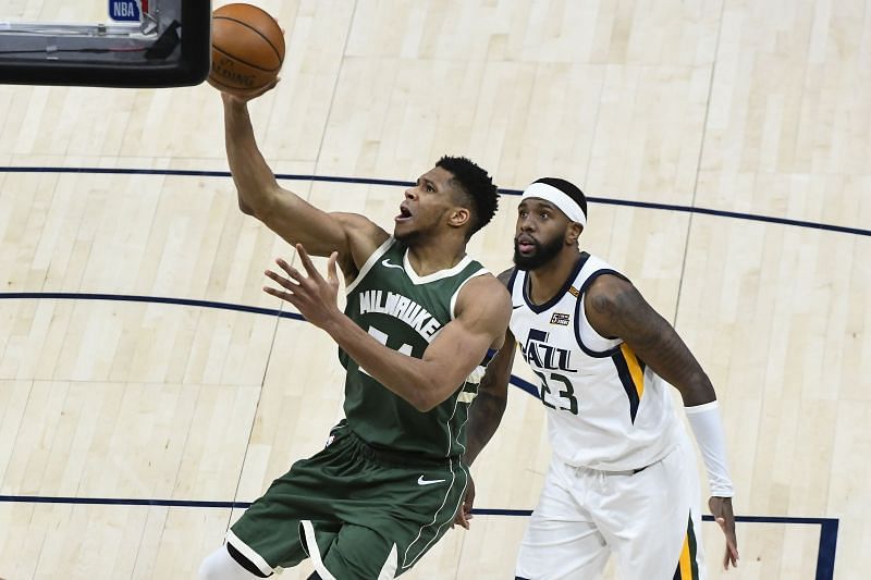 Giannis Antetokounmpo #34 of the Milwaukee Bucks shoots over Royce O&#039;Neale #23 of the Utah Jazz during a game at Vivint Smart Home Arena on February 12, 2021 in Salt Lake City, Utah. (Photo by Alex Goodlett/Getty Images)