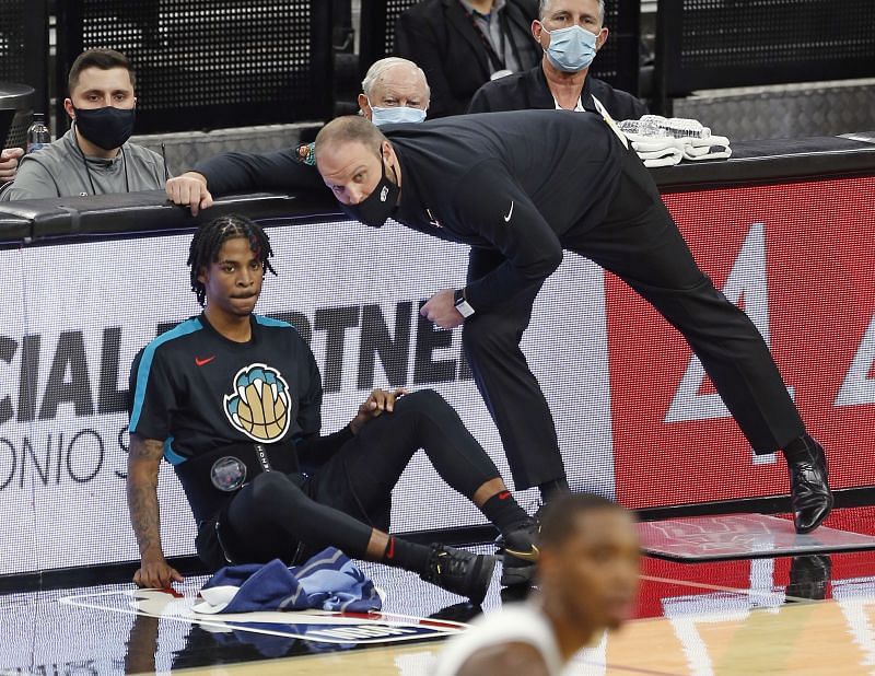 Head coach of the Memphis Grizzlies Taylor Jenkins confers with Ja Morant of the Memphis Grizzlies during the game against the San Antonio Spurs at the AT&amp;T Center&nbsp;