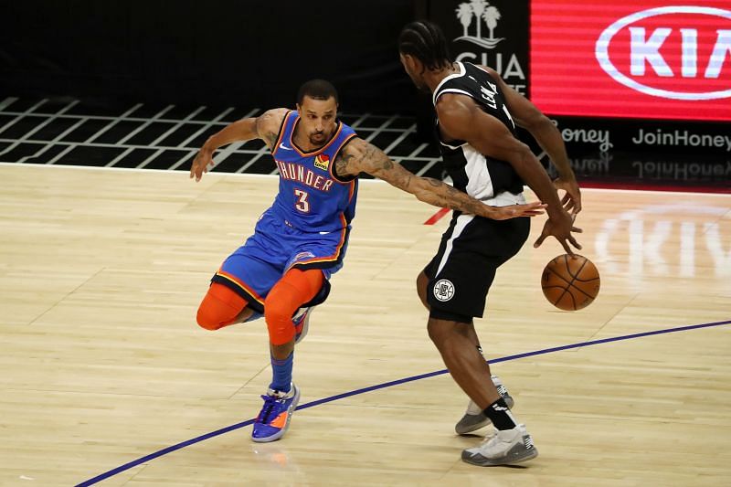 Oklahoma City Thunder's George Hill (L) in action